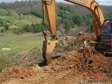 remove stumps with mini excavator|excavator stump removal attachment.